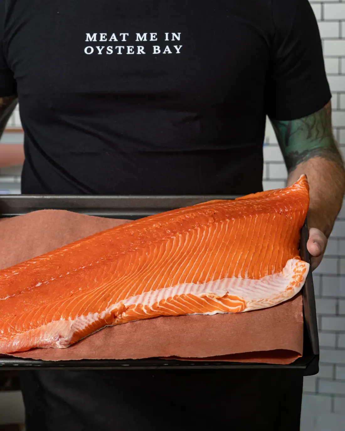 Fresh salmon fillets on ice